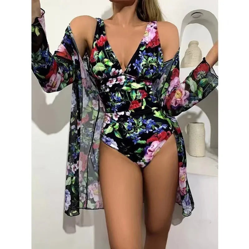 Women's floral print bikini three-piece swimsuit set with matching coat in a selection of colours.