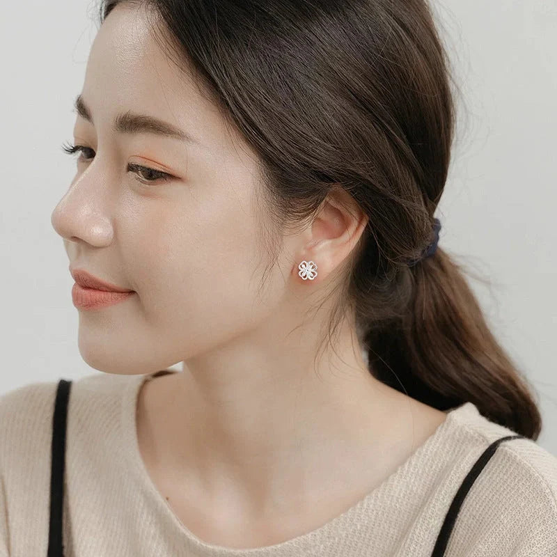 Elegant floral sterling silver stud earrings with screw-back closure for all-day wear