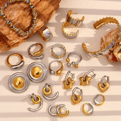 Gold electroplated stainless steel earrings, necklace, and bracelet set with geometric shapes and round ring elements