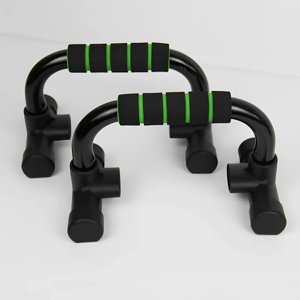 Green suction cup push-up bracket with electroplated steel frame and foam handles for chest exercises