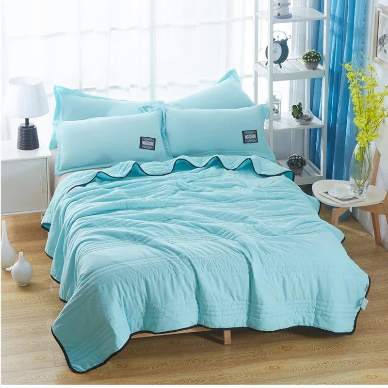 Lightweight, breathable cooling comforter in various colors and sizes for summer sleep comfort