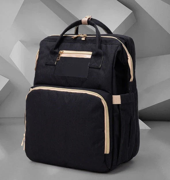 Versatile baby changing backpack with USB charging port and folding portable bed