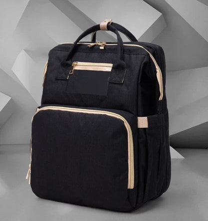 Versatile baby changing backpack with USB charging port and folding portable bed