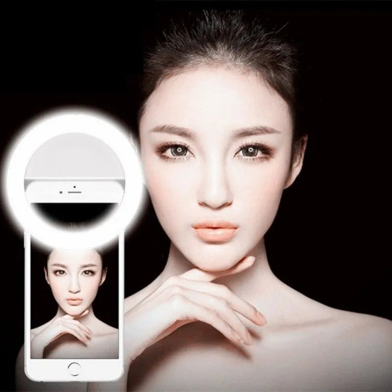 Green clip-on selfie ring light attached to mobile phone with anti-slip sponge visible