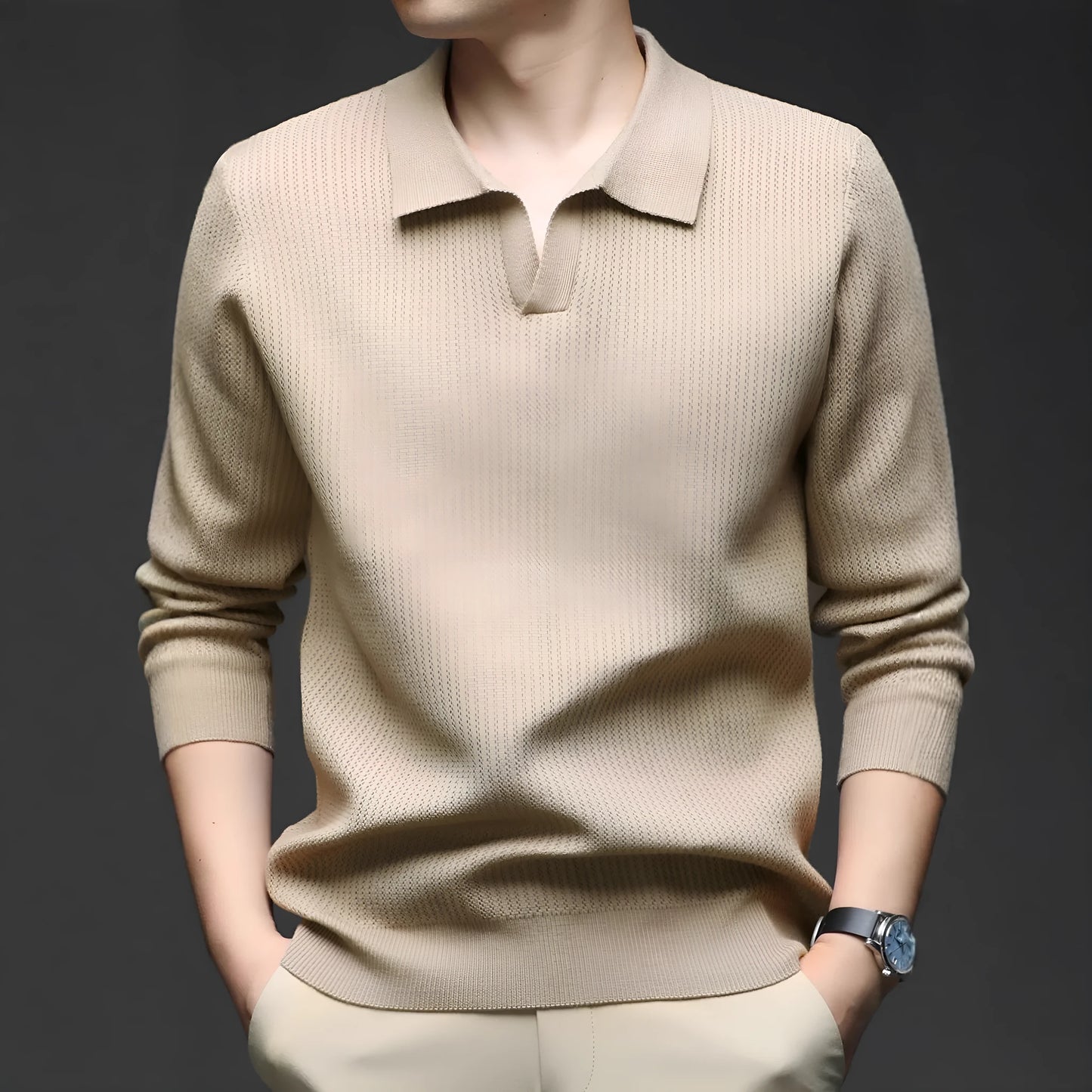 Man wearing a loose fit camel coloured pullover sweater, a casual autumn layer with a simple design.