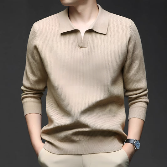 Man wearing a loose fit camel coloured pullover sweater, a casual autumn layer with a simple design.