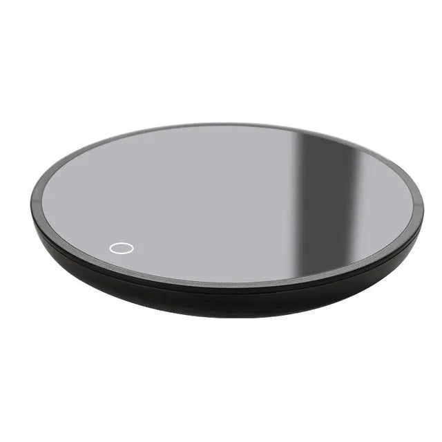 Black coffee mug warmer pad with temperature switch on desk