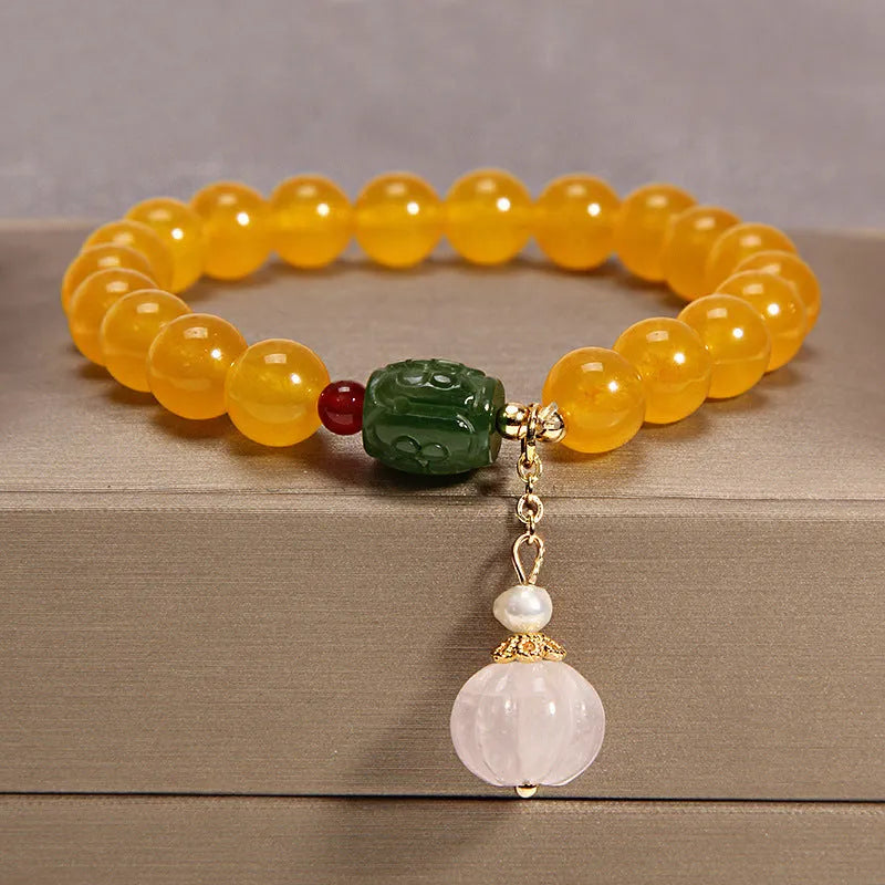 Women's yellow agate crystal bracelet on gold silk cord with Japanese style design