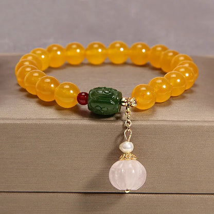 Women's yellow agate crystal bracelet on gold silk cord with Japanese style design