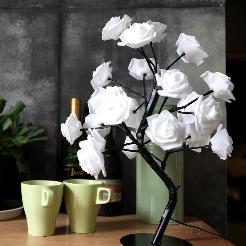 White and red rose flower LED lamp on a bonsai tree stand with warm white lights.