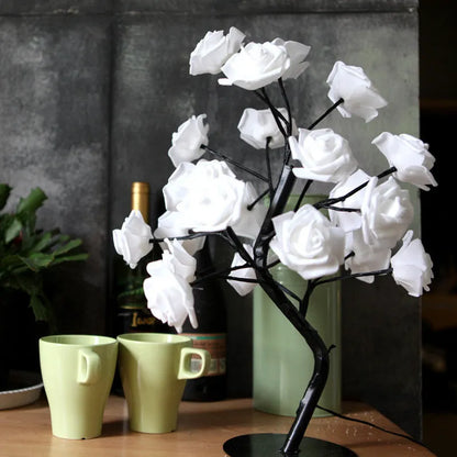 White and red rose flower LED lamp on a bonsai tree stand with warm white lights.