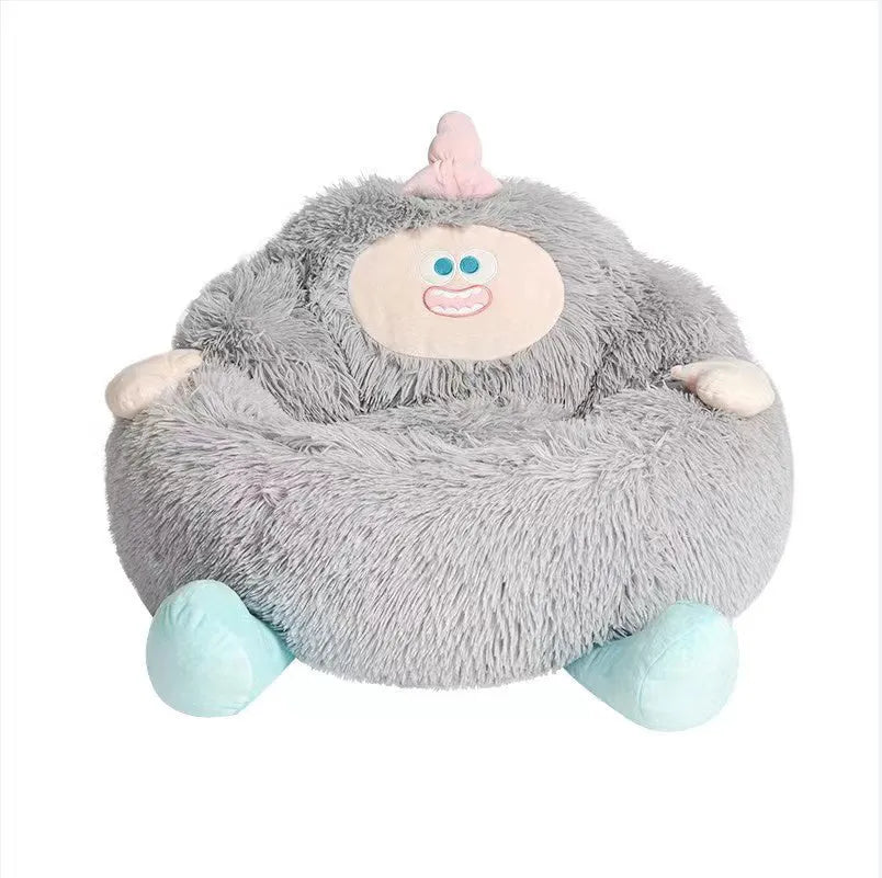 Grey plush donut-shaped pet nest bed with raised edges for a cat or dog.