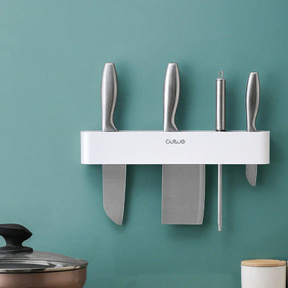 Sleek wall-mounted knife organizer with slots for knives and hooks for storing kitchen essentials