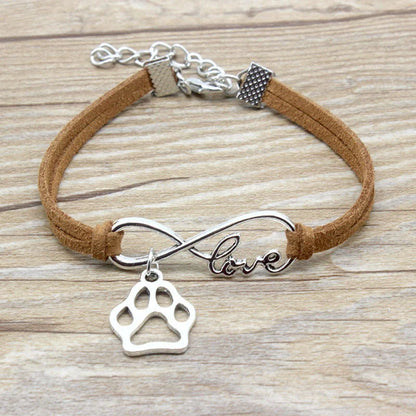 Hand-woven Infinite Love Pet Bracelet in various colors, showcasing the bow shape and alloy material.