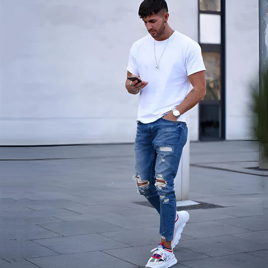 Men's distressed hole style jeans in deep blue cotton denim