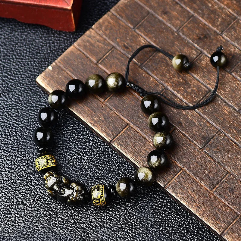 Hand-woven golden obsidian Pi Xiu bracelet with animal design, showing bead size options.