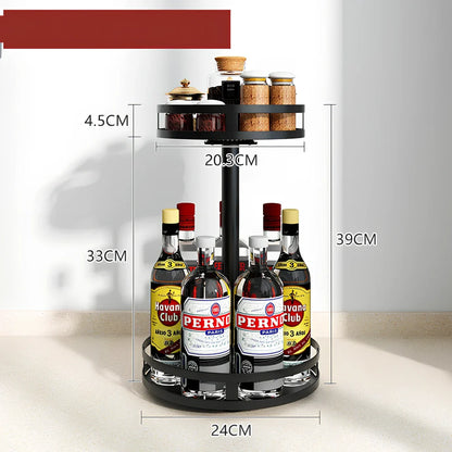 Stainless steel rotating spice rack with two tiers holding 12 bottles on kitchen countertop