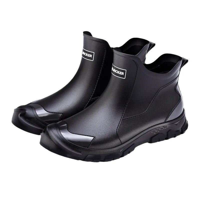 Low-cut solid colour PVC rain boot with round toe and plastic sole.