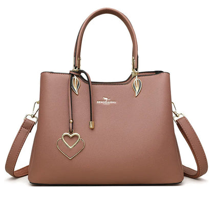 Women's black PU leather messenger bag with multi-layer shoulder strap and sewing thread detailing.