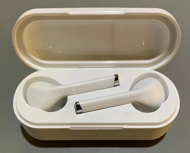 Black and white Bluetooth 5.0 wireless headphones with charging dock showing USB charging port