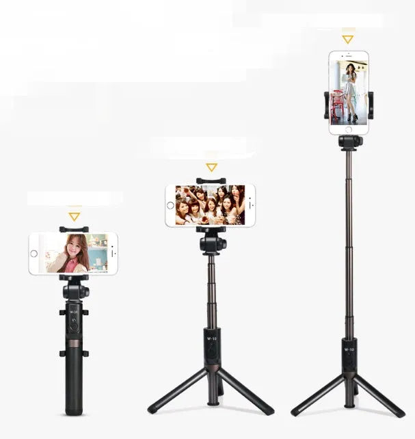 Black aluminium Bluetooth selfie stick with tripod legs extended, holding a mobile phone.