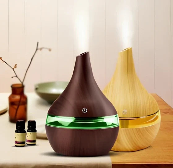 Round wood grain humidifier with USB cable on wooden surface
