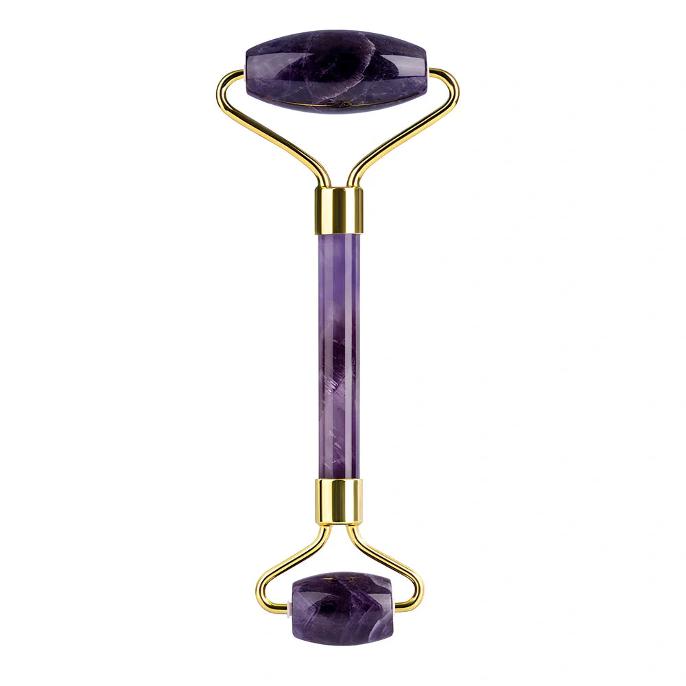 Amethyst facial roller set with heart-shaped gua sha and claw massage tools on white background