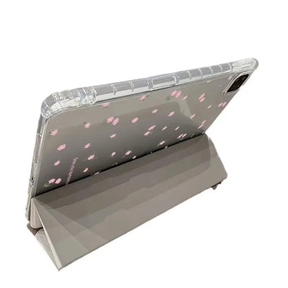 Transparent floral print hard case for iPad with tri-fold front cover forming a stand