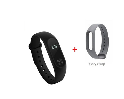 Xiaomi Mi Band 2 black fitness tracker with OLED display showing heart rate and time on adjustable wrist strap