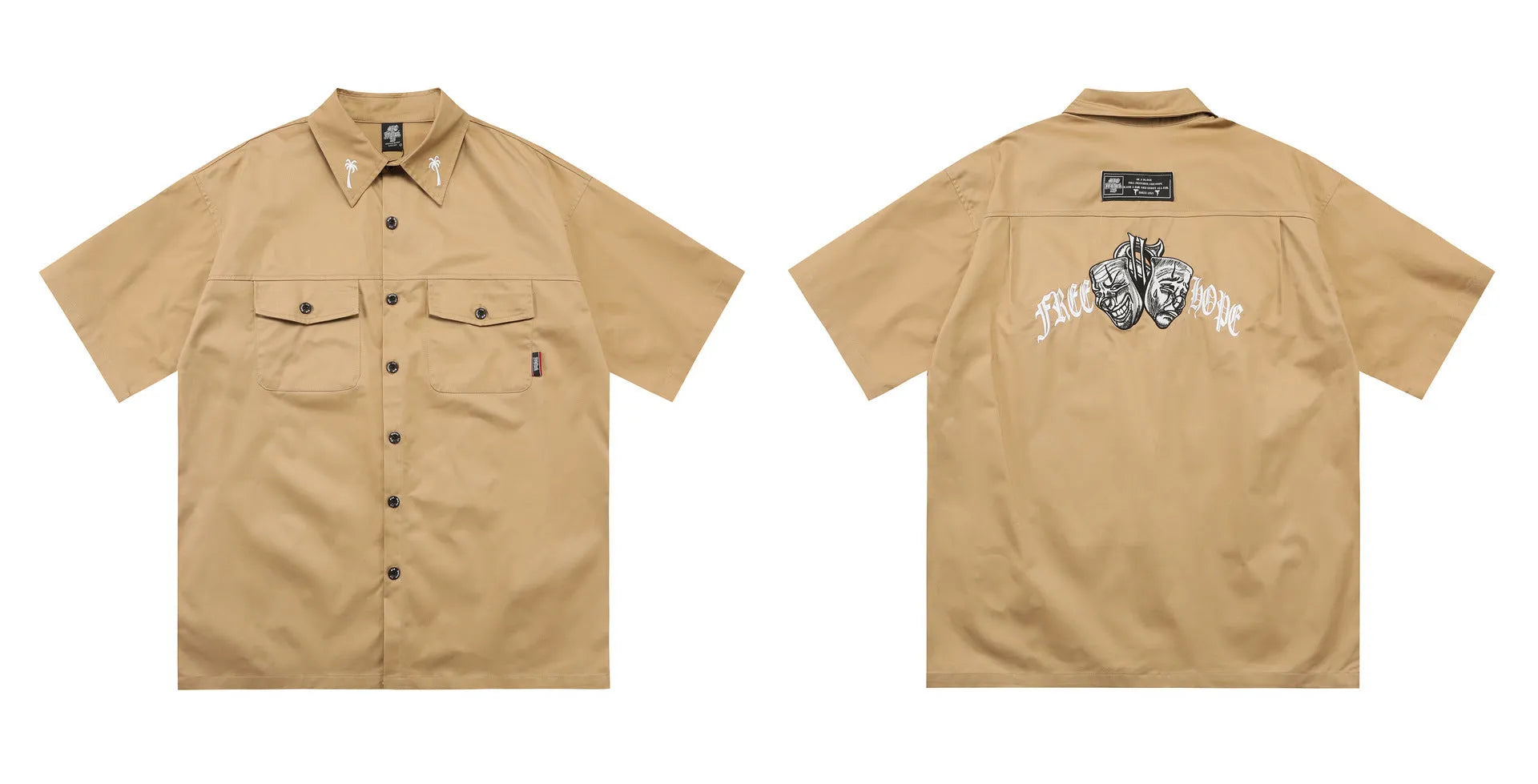 Man wearing a black cotton blend half-sleeve loose fit work shirt with embroidered detail.