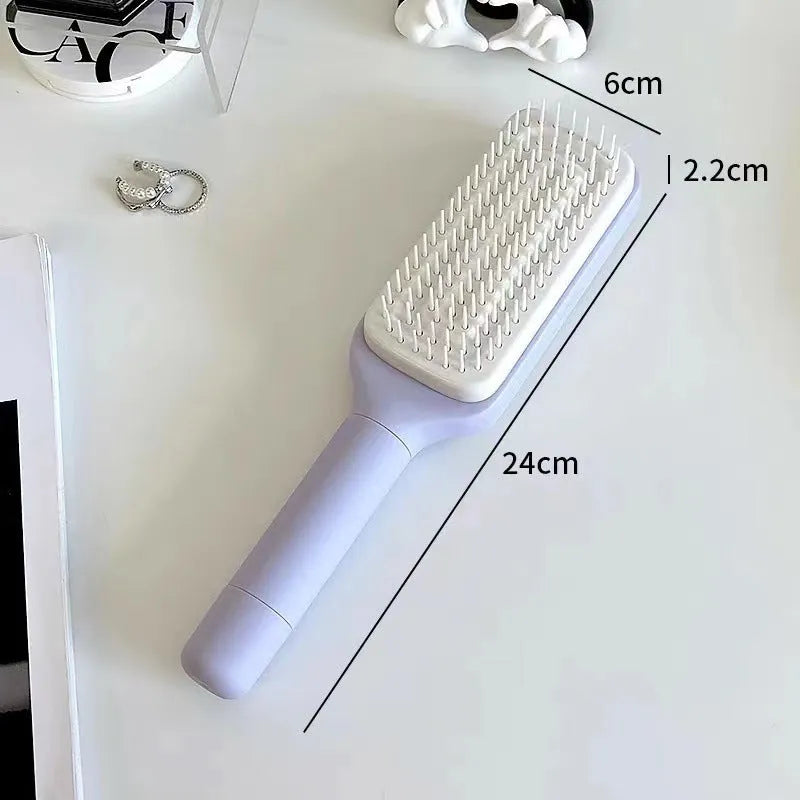 Roland Purple self-cleaning hair brush with rotating telescopic handle and anti-static bristles.