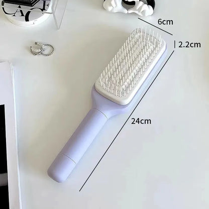 Roland Purple self-cleaning hair brush with rotating telescopic handle and anti-static bristles.
