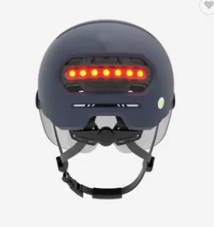 Cycling helmet with integrated automatic LED brake light system, showing PC shell construction