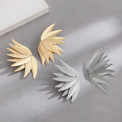 Gold and white alloy leaf-shaped patch earrings with dangle design