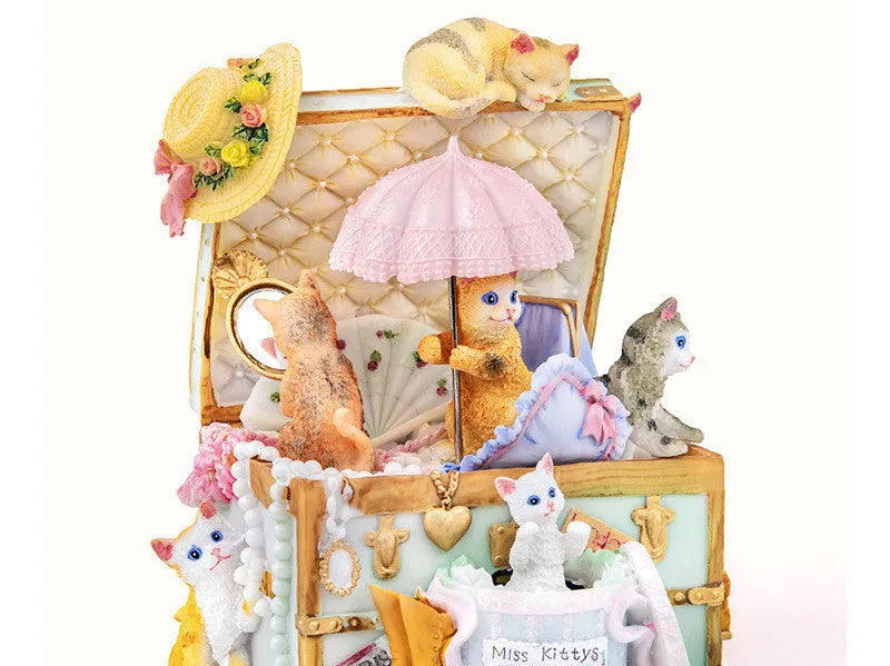 Cold porcelain cat-shaped music box with jewellery storage, rotating snowflake light, and mechanical movement