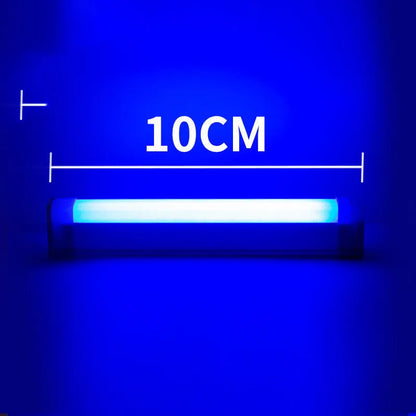 Blue rechargeable LED light tube with USB plug and push-button switch on a dark surface