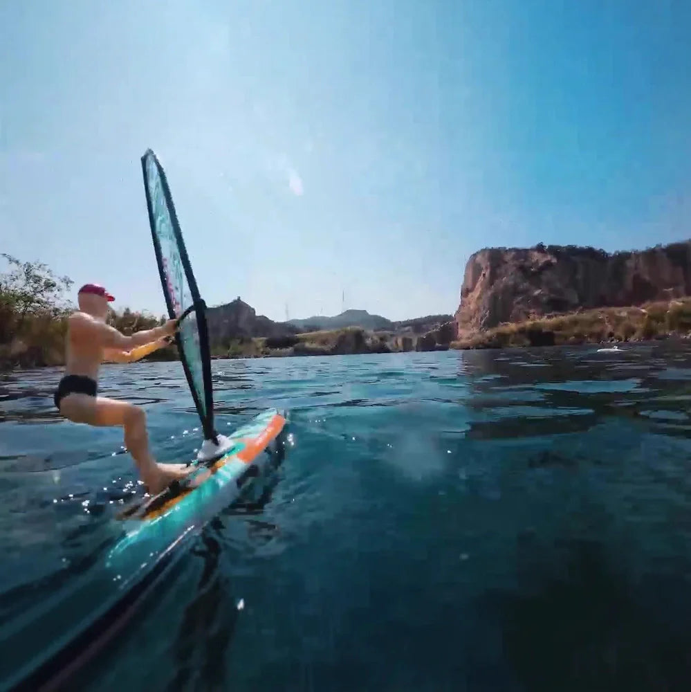 Blue remote control speedboat toy on water with USB charging cable