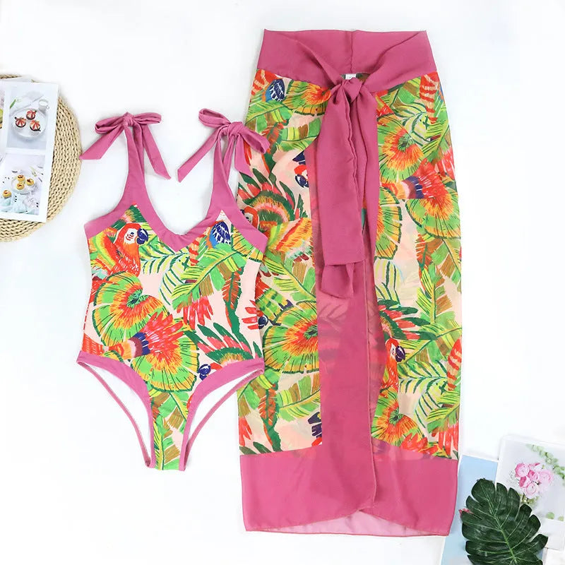 Pink floral print women's retro swimsuit with V-neck and attached thin skirt cover