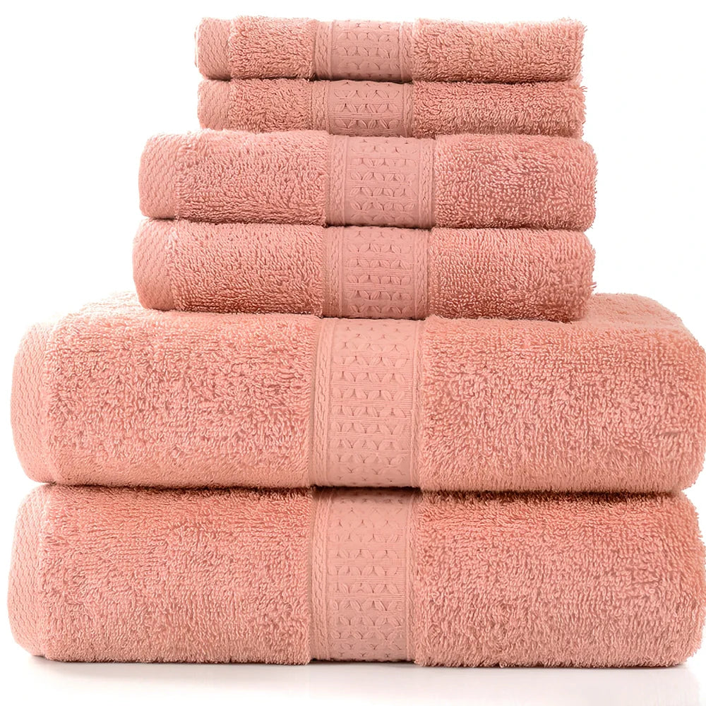 Cotton towel set showing bath towel, hand towel, and face cloth in coordinated sizes