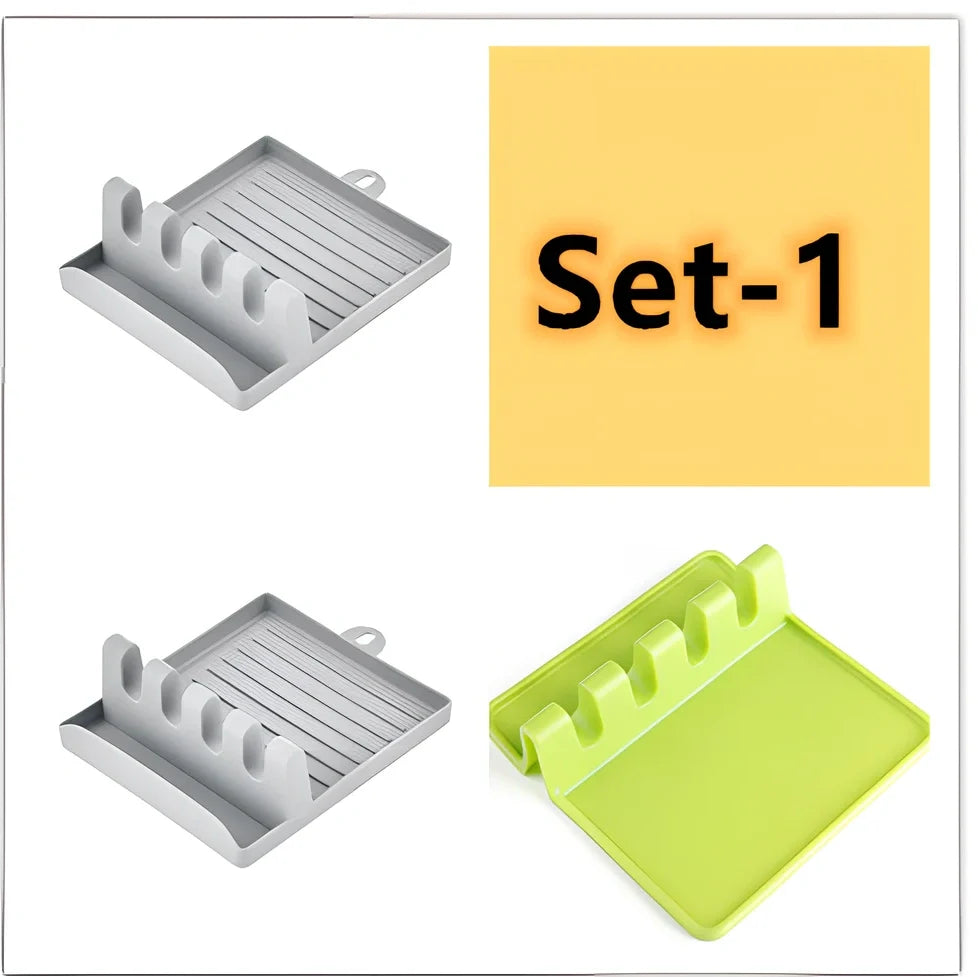 Green silicone spatula holder with four slots for kitchen utensils on countertop