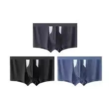 Man wearing black ice silk double-layer underwear shorts with a hole bag design for dry wet separation.
