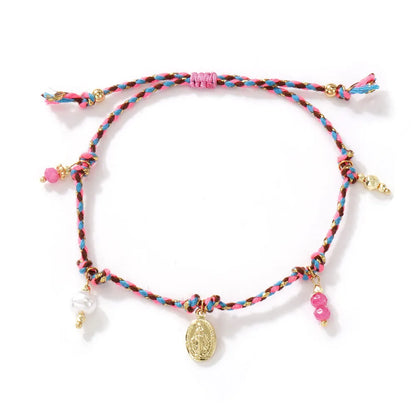 Close-up of a colourful hand-woven braided rope bracelet for women, showing ethnic strap design.