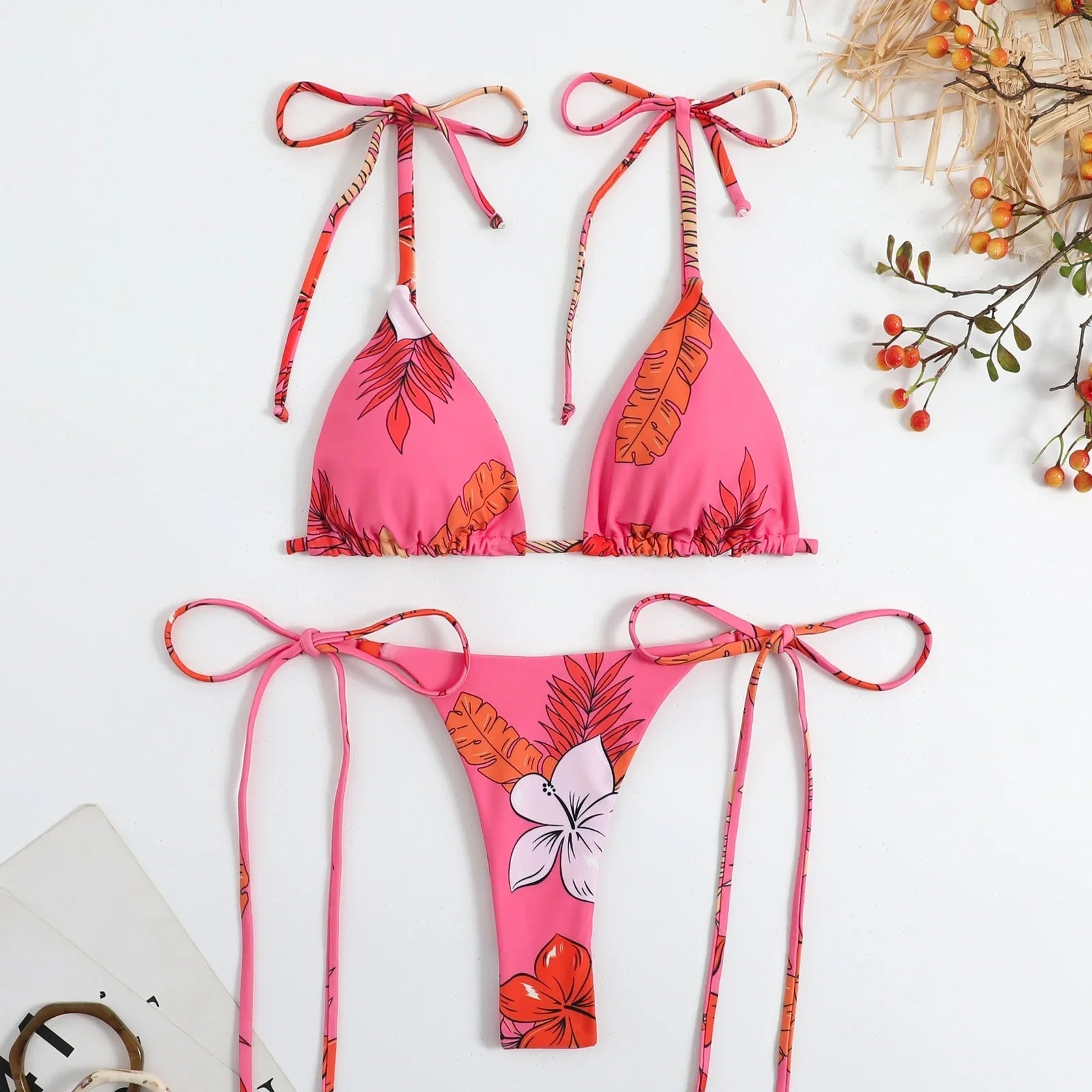 Women's split swimwear bikini set with backless design and floral pattern in available colours