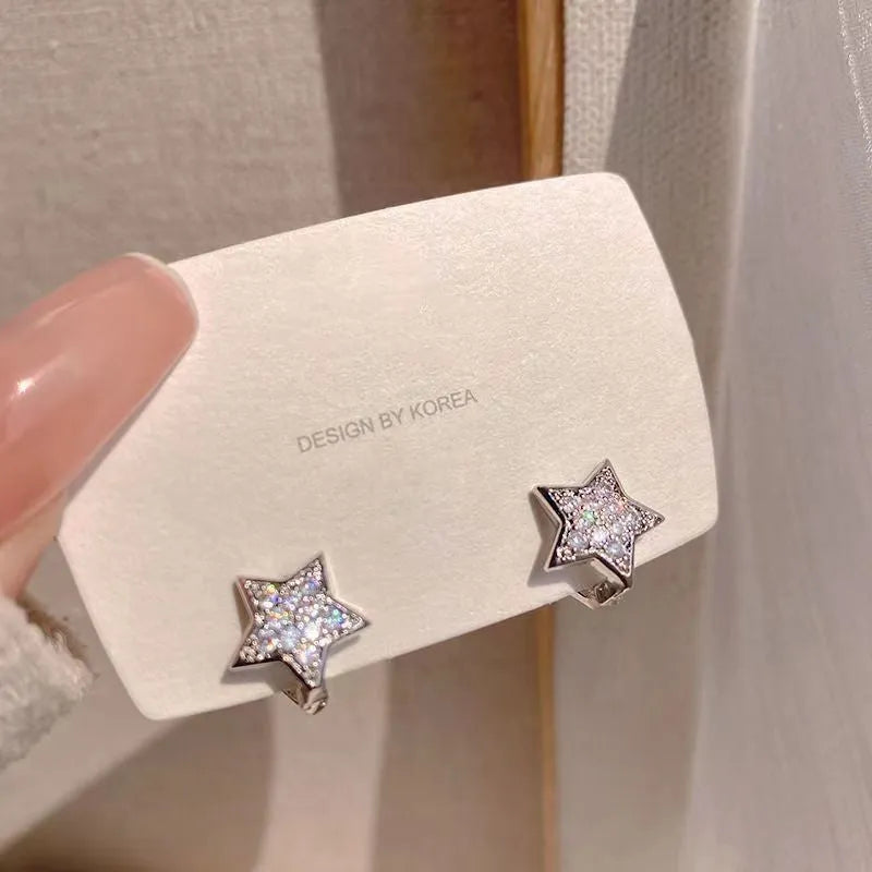 White star zircon earrings for women with copper base and electroplated finish, geometric shape, one pair