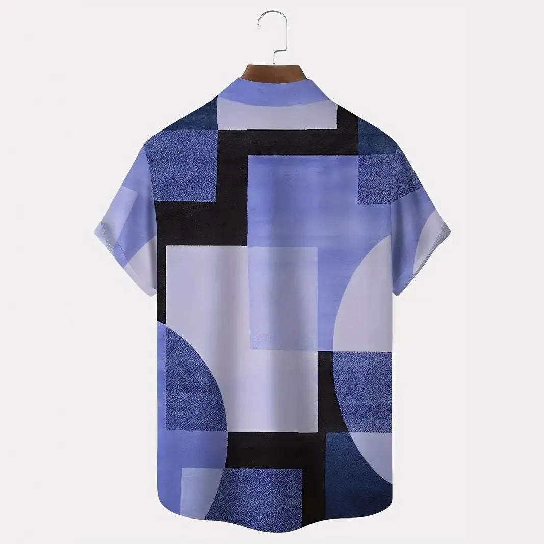 Man wearing a loose-fit short sleeve cardigan shirt with a retro geometric square pattern in contrasting colours.