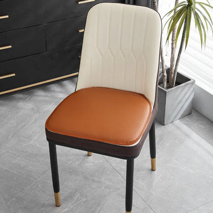Leather horseshoe-shaped seat cushion in beige colour on a chair, showing non-slip base and 2.5cm thickness.