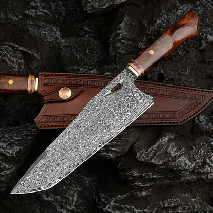 Damascus steel kitchen knife with 21.8cm blade and milky off-white finish on cutting board
