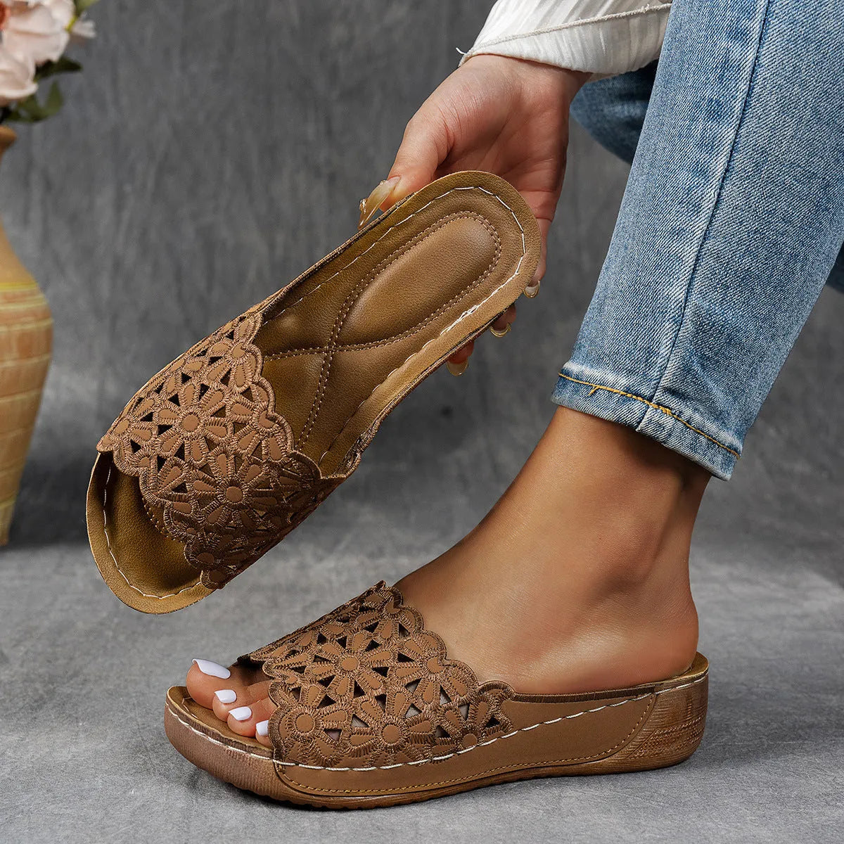 Women's black wedge beach slippers with flower cutout decoration on the PVC upper