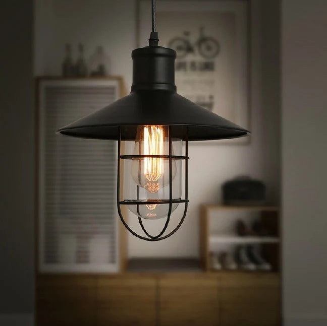 Black iron pendant lamp with cage-style explosion-proof glass shade and adjustable hanging chain