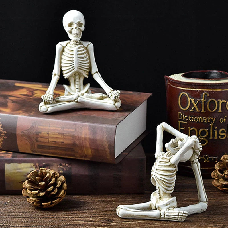 Spooky skeleton desktop decorations featuring intricate resin skulls and skeletons in vintage white and ominous black color options